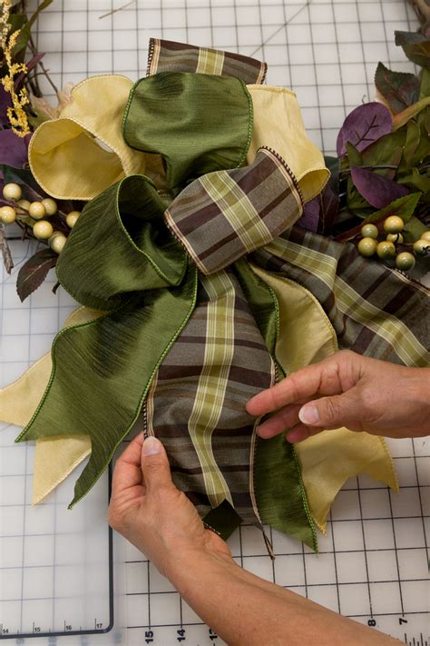 Pinch the fabric together in the very middle to create the 2 sides of your <b>bow</b>, and hold the fabric together using your non-dominant hand. . How to make bows for wreaths